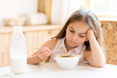 Young girl reluctant to eat 