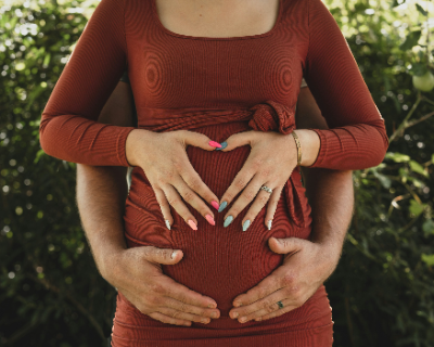 Bumpin' in Style: The Ultimate Guide to Maternity Fashion 36 Pregnant woman wearing a stretchy gown