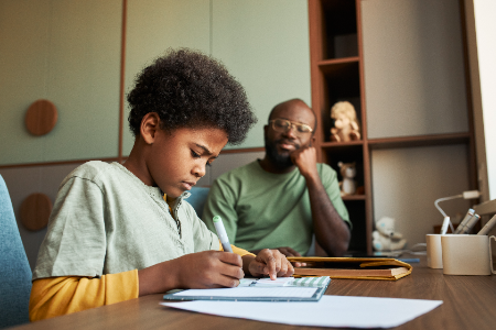 Parental Involvement In Education: The Proven Key to Academic Excellence and Lifelong Learning 36 A father observing a child as he studies