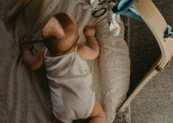 A toddler sleeping in a cozy bed